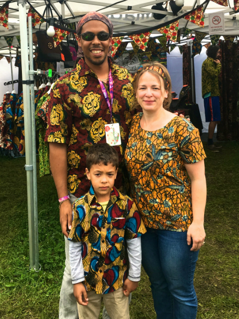 Women's yellow African print top blouse with short sleeve modelled by a customer at WOMAD Festival UK