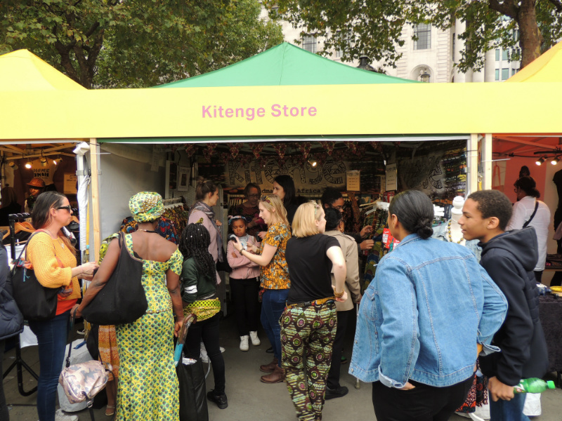 The busy Kitenge Store Stall selling modern african print clothing at Africa on The Square 2017 in Trafalgar Square London