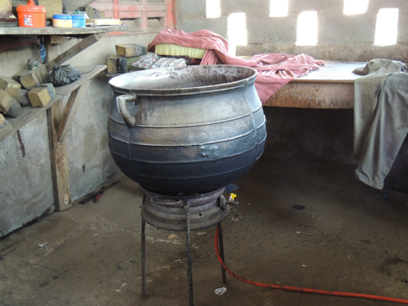 A basin where the wax is melted inside for making traditional batik fabric by hand in a Ghanaian workshop 
