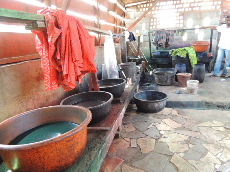 Different colour dye baths inside a traditional batik making workshop in Ghana West Africa