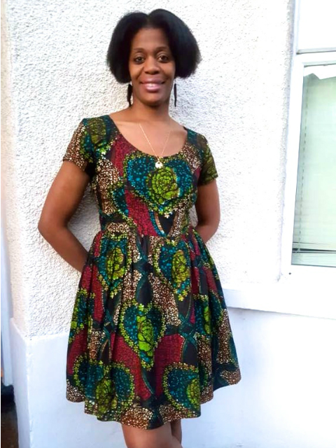 Women's multicoloured African print dress Kitenge customer wearing outside