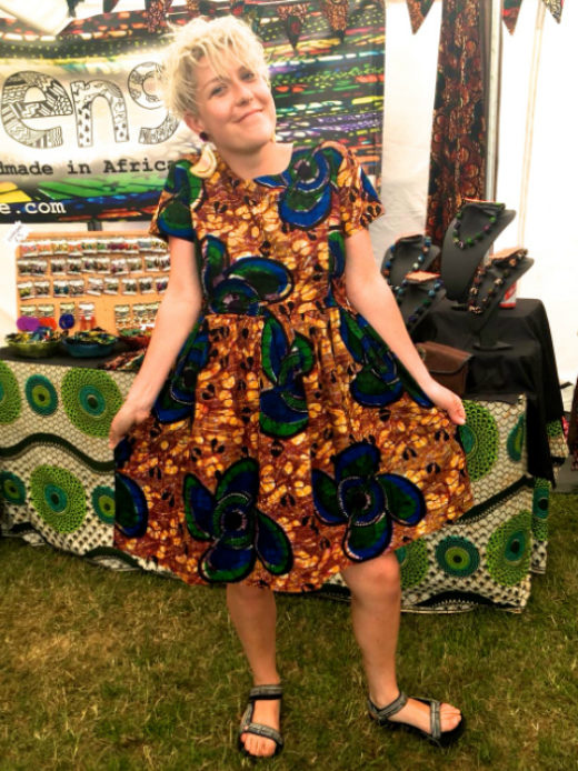 Women's yellow African print flare dress customer wearing Africa Oye Festival in Liverpool UK