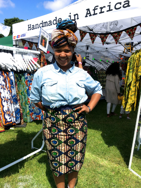 Women's black diamond African print pencil skirt customer modelling at Africa Oye Festival in Liverpool UK