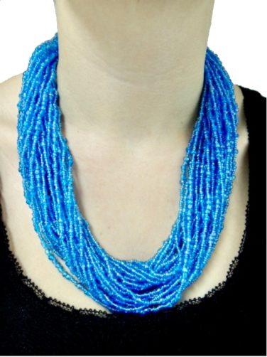 Women's light blue beaded necklace model wearing front view
