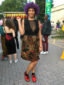 kitenge store customer modelling her red/green african print skirt at AfroFest in Bristol UK