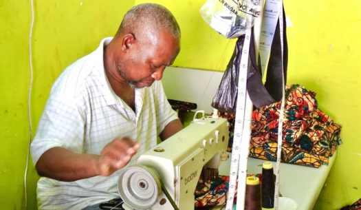 Kitenge Store master tailor sewing made to measure clothing in Tanzania
