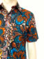 Men's red blue African print short sleeve shirt model wearing pocket close up