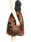 Women's red/green flower African print fabric flare skirt model wearing side view