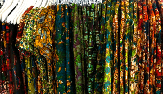 Kitenge Store's African wax print clothing displayed on a clothes rail at a social enterprise Christmas fair at RSA insurance group's offices in Central London