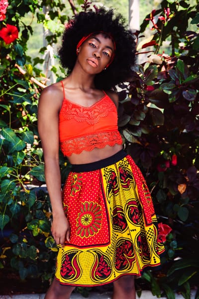 Traditional African clothing red yellow kanga African print skirt model wearing