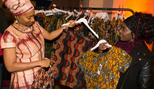 Happy Kitenge Store customers browsing our modern African print clothing at Bristol Museum's Fabric Africa fashion show event