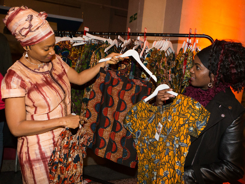 Happy Kitenge Store customers browsing our modern African print clothing at Bristol Museum's Fabric Africa fashion show event