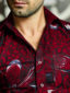 Men's maroon flower custom-made African print short sleeve shirt model wearing collar closeup
