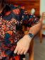 Men's red/blue flower custom-made African print short sleeve shirt model wearing pocket closeup