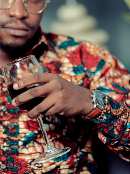Men's red floral custom-made African print long sleeve shirt model wearing cuff closeup