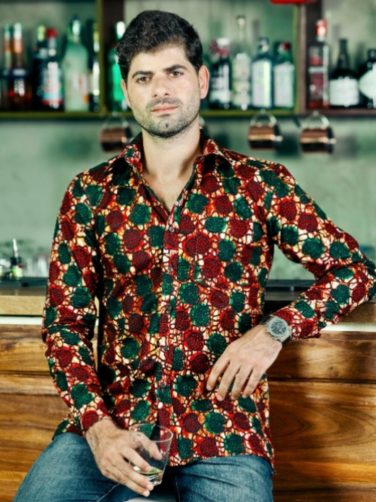 Men's red/green custom-made African print long sleeve shirt model wearing front view