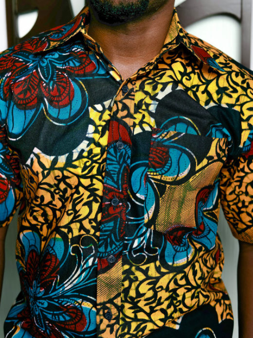 Men's yellow/blue flower custom-made African print short sleeve shirt model wearing front view closeup