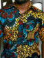 Men's yellow/blue flower custom-made African print short sleeve shirt model wearing front view closeup