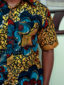 Men's yellow/blue flower custom-made African print short sleeve shirt model wearing pocket closeup