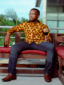 Men's yellow/brown shells custom-made African print long sleeve shirt model wearing front view full outfit