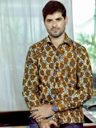 Men's yellow/cream custom-made African print long sleeve shirt model wearing front view