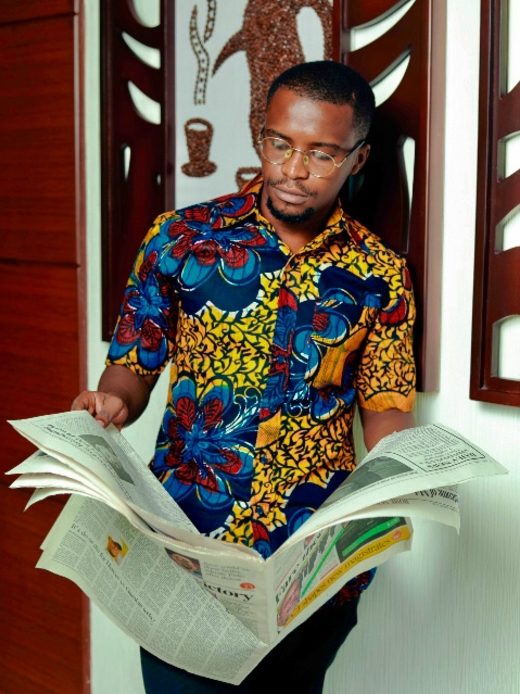 Men's yellow/red/blue flower custom-made African print short sleeve shirt model wearing front view