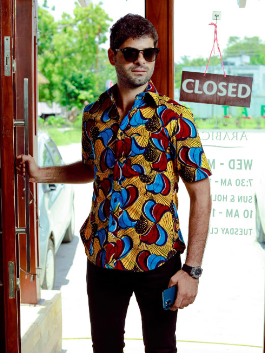 Men's yellow/red/blue peacock custom-made African print short sleeve shirt model wearing front view