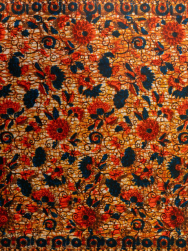 Red and blue floral African print fabric design made in Nigeria West Africa