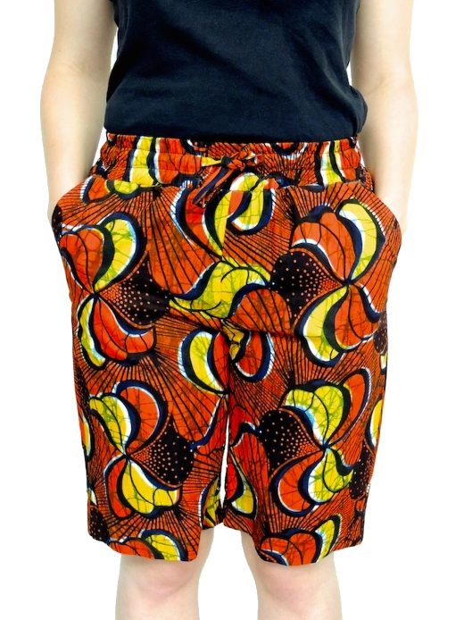 Women's red/yellow African print custom-made shorts model wearing front view
