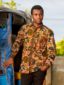 Men's green/blue floral African print long sleeve shirt model wearing front view