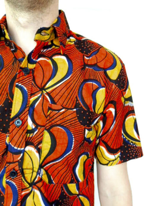Men's red African print short sleeve shirt model wearing pocket detail closeup