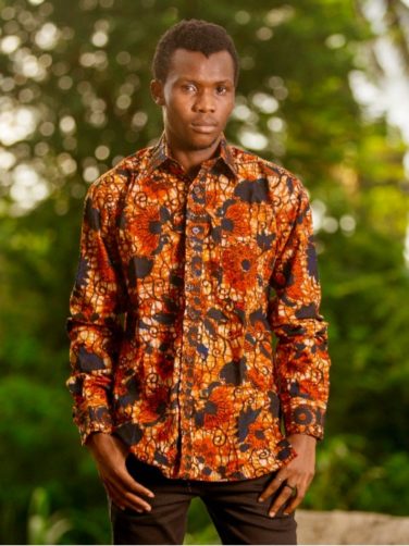 Men's red/blue floral African print long sleeve shirt model wearing front view