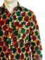 Men's red/green African print long sleeve shirt model wearing front view side pocket closeup