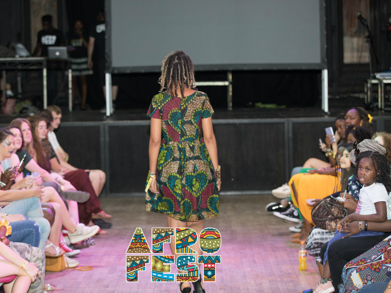 Back view of a model wearing a Kitenge African print dress during the fashion show at AfroFest Bristol 2019