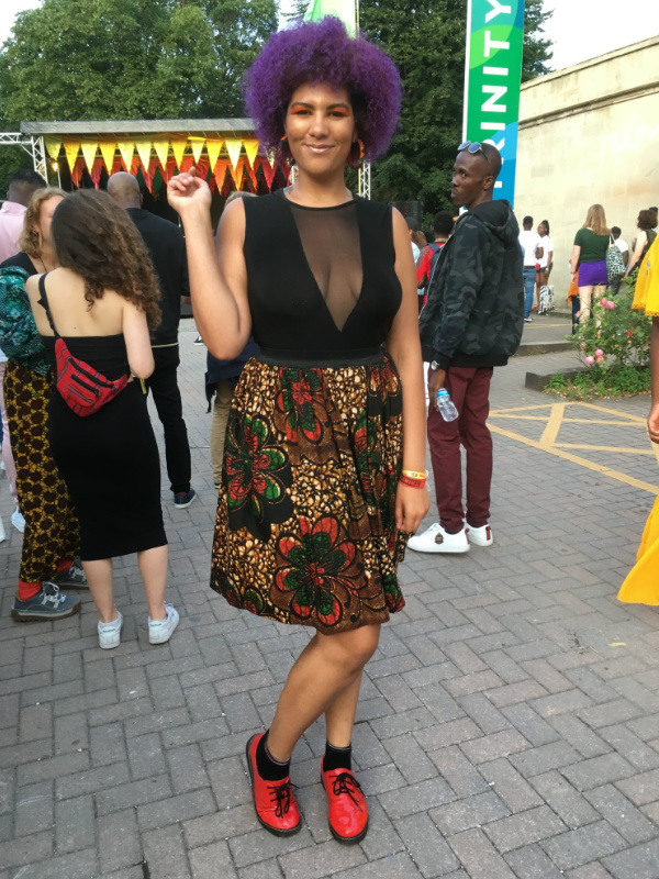A happy Kitenge customer and AfroFest Bristol 2019 DJ modelling her new red/green flower African print skirt