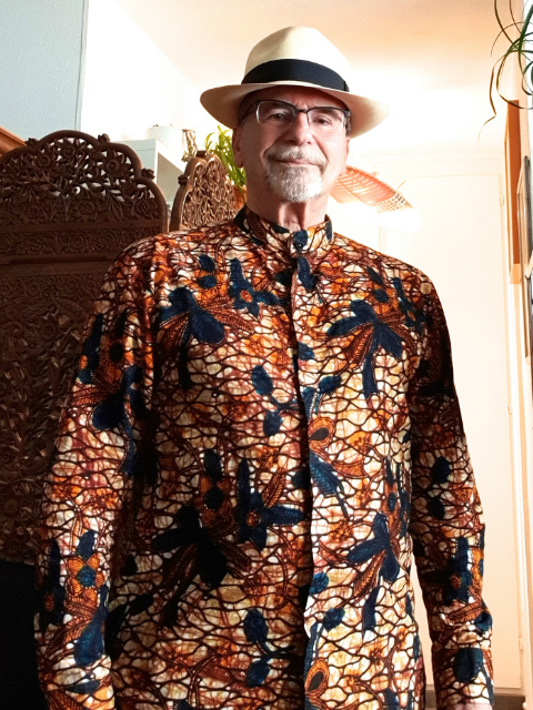Kitenge made to measure custom made shirt customer from Switzerland wearing his new brown floral long sleeve African print shirt