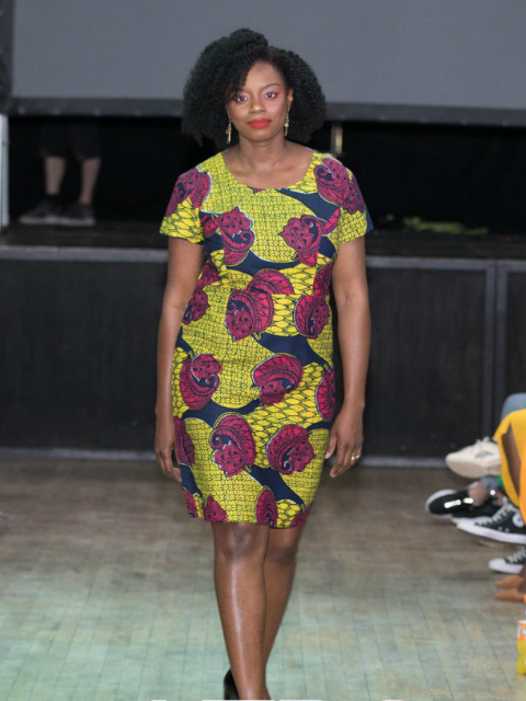 Women's yellow African print dress pencil style worn by model at AfroFest 2019 fashion show