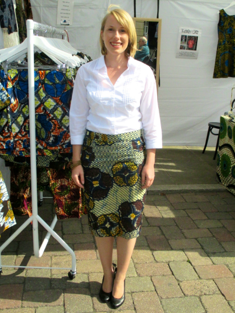 Kitenge founder Sian wearing African print pencil skirt with white shirt-and heals African fashion trend 2020