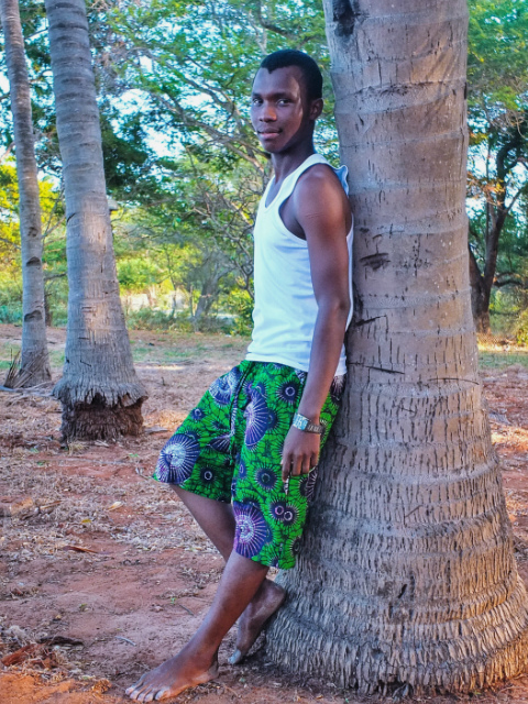 Men's African print made to measure shorts model wearing beach Tanzania