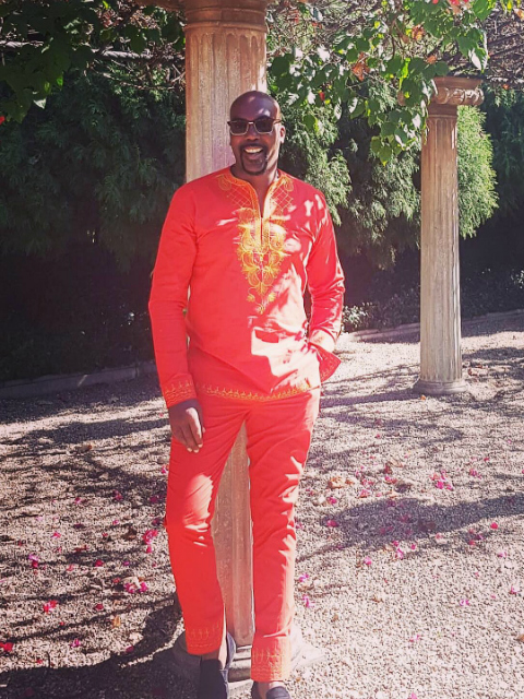 Men's red bespoke trousers online and matching traditional African clothing kaftan customer wearing South Africa