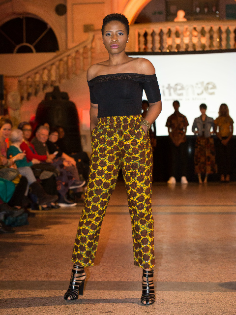 Women's brown made to measure trousers model wearing African fashion catwalk