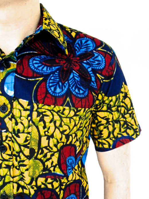 Men's yellow red blue flower African print shirt with short sleeves model wearing side pocket closeup