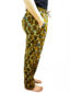 Women's custom made to measure yellow cream African print trousers model wearing side view