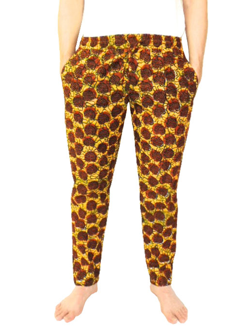 Men's brown/yellow African print trousers model wearing front view