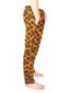Men's brown/yellow African print trousers model wearing side view