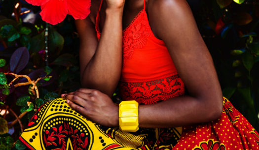 Kitenge model wearing an African print skirt made from kanga cloth
