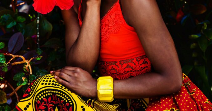 Kitenge model wearing an African print skirt made from kanga cloth