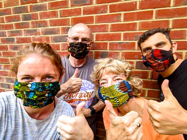 Kitenge African print fabric face masks modelled by a UK family