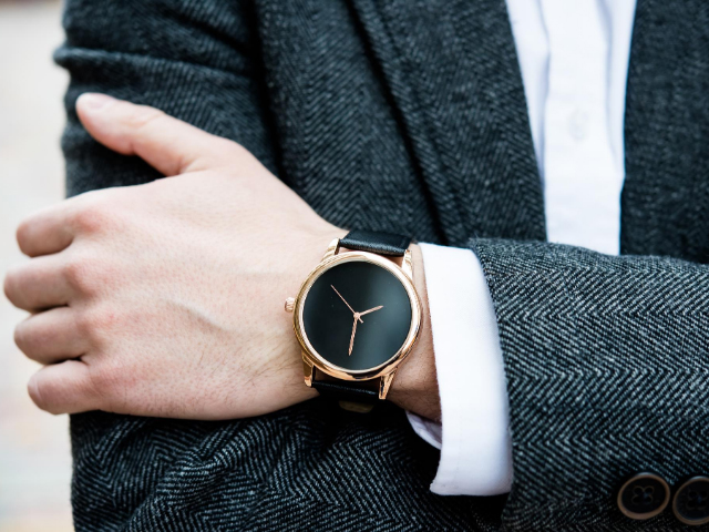 Men's smart black leather watch to match charcoal herringbone suit