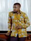 Men's yellow pineapple custom-made African print shirt with long sleeves model wearing front view